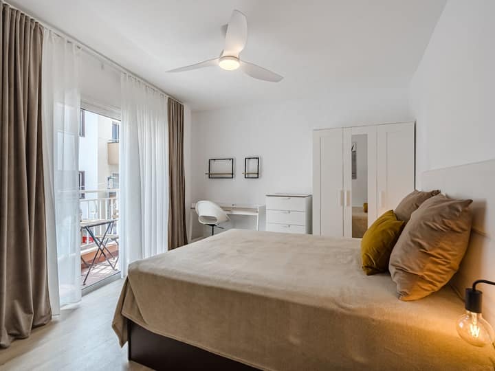 Bedroom with balcony access
