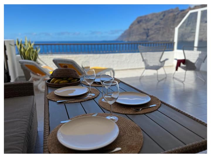 Terrace dining with the cliffs behind