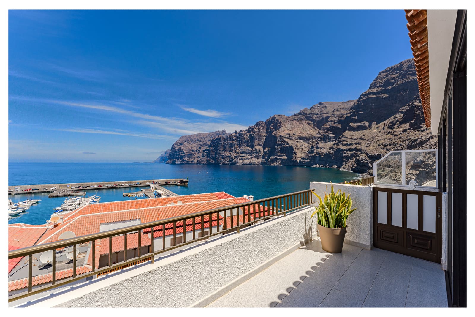 Terrace view over the Los Gigantes marina and cliffs